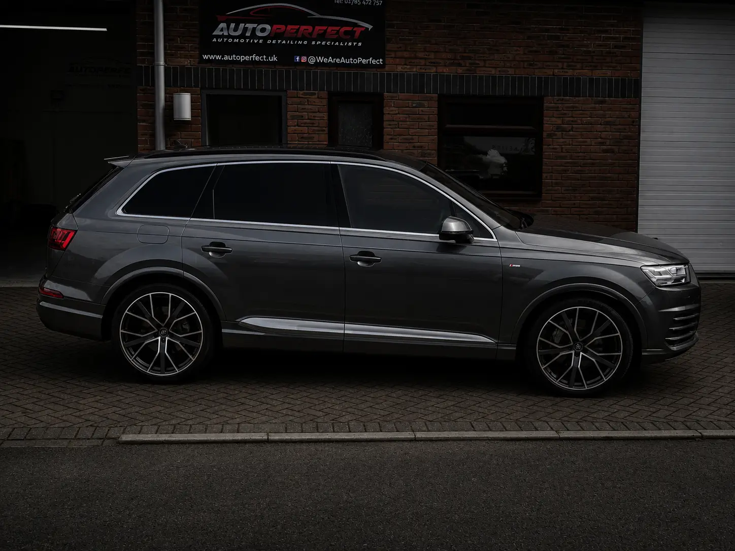 Grey Audi Q7 with tinted windows outside the AutoPerfect unit in Stone, Staffordshire