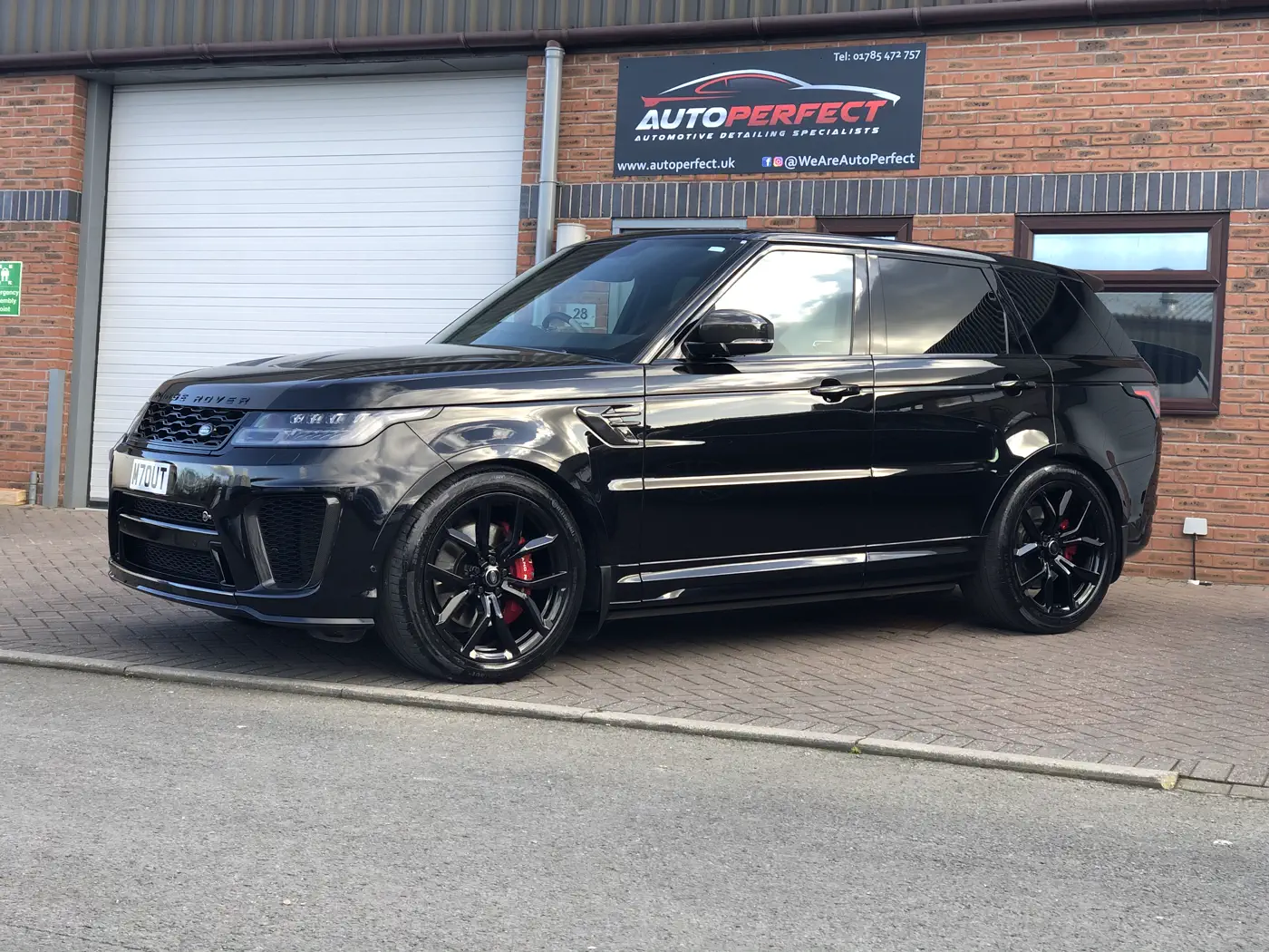 Detailed and ceramic-coated Range Rover SVR outside the AutoPerfect unit, Stone